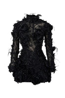 Black Liliane lace mini dress by 21Six, featuring intricate lace details and a fitted silhouette, shown on a model.