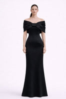 Nihan Peker Ghada black gown featuring elegant fabric and flowing silhouette, perfect for formal occasions.
