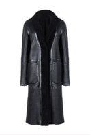 Black Zina biker shearling coat by Verheyen featuring a stylish collar and zipper details, displayed on a hanger.