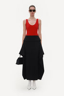 Black wool midi skirt by ELENAREVA, featuring a sleek, tailored design and a mid-length silhouette, perfect for stylish everyday wear.