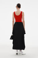 Black wool midi skirt by ELENAREVA, shown with a fitted waist and flowing length, perfect for stylish everyday wear.