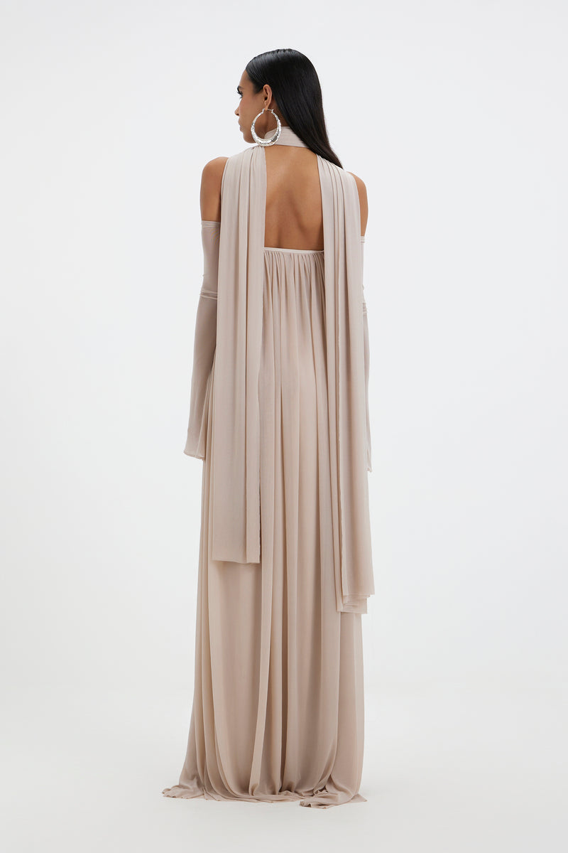 Deme By Gabriella Becki Maxi Dress in flowing fabric with a floral pattern, full-length design, and sleeveless style.