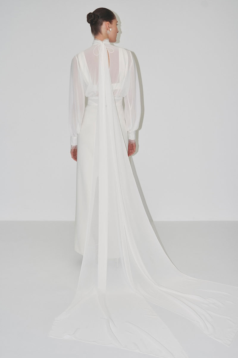 Cropped bridal cape in bambula silk by JC Pajares, elegant cover-up with delicate fabric and detailed craftsmanship.