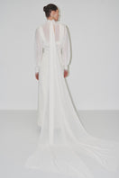 Elegant cropped bridal cape made of bambula silk by JC Pajares, perfect as a sophisticated cover-up for wedding looks.