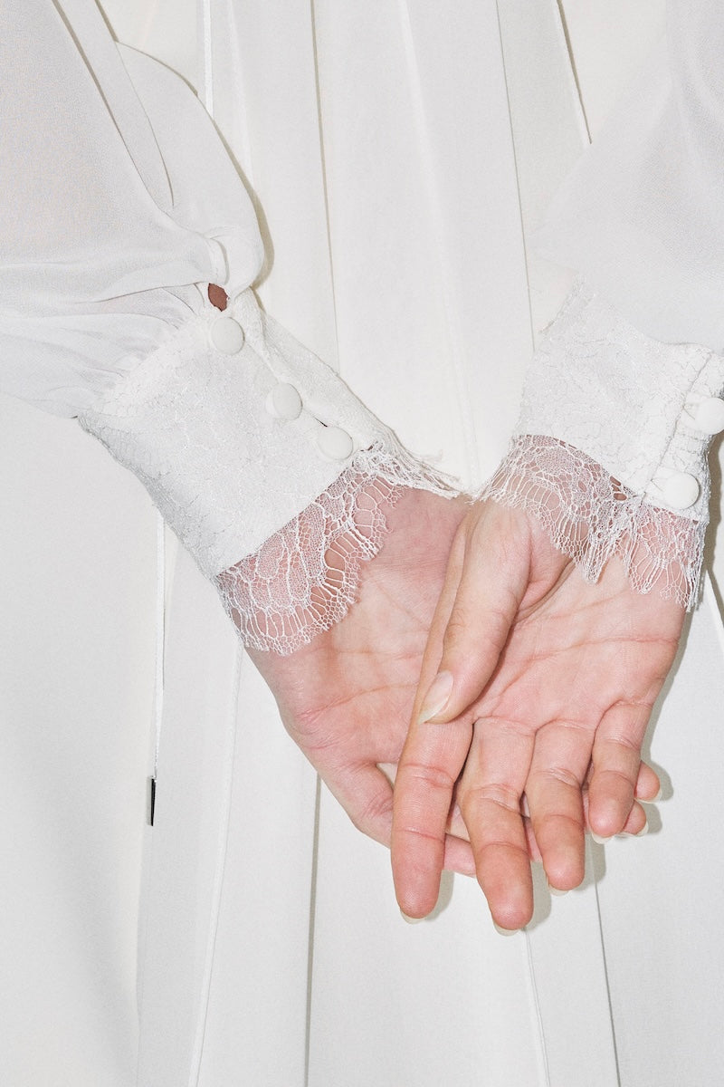Cropped bridal cape in bambula silk by JC Pajares, elegant cover-up with delicate details perfect for wedding attire.