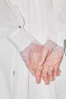 Cropped bridal cape in bambula silk by JC Pajares, elegant cover-up for wedding or special occasion attire.
