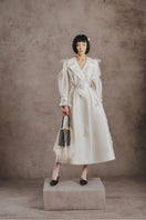 Ivory embroidered trench coat from White Plan featuring detailed embroidery, classic collar, and button closure.