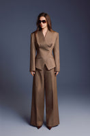 Folded Keira Tong blazer, stylish and tailored, displayed neatly on a flat surface with visible fabric texture and classic design.
