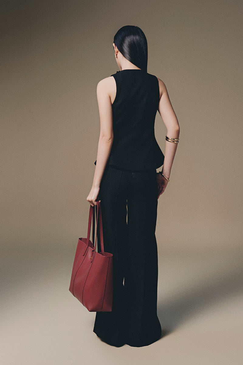 Wide leg tweed pants by Keira Tong featuring a classic textured fabric and relaxed fit, shown on a model.