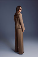 Keira Tong minimal wide-leg pants shown on a model, featuring a relaxed fit and neutral fabric for a modern, stylish look.