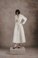 Ivory embroidered trench coat by White Plan, stylish long coat with intricate embroidery, perfect for fashion-forward wear.