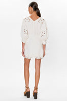 Rebecca Taylor Rachelle button-front mini dress in ivory, featuring a fitted bodice and short sleeves, displayed on a hanger.