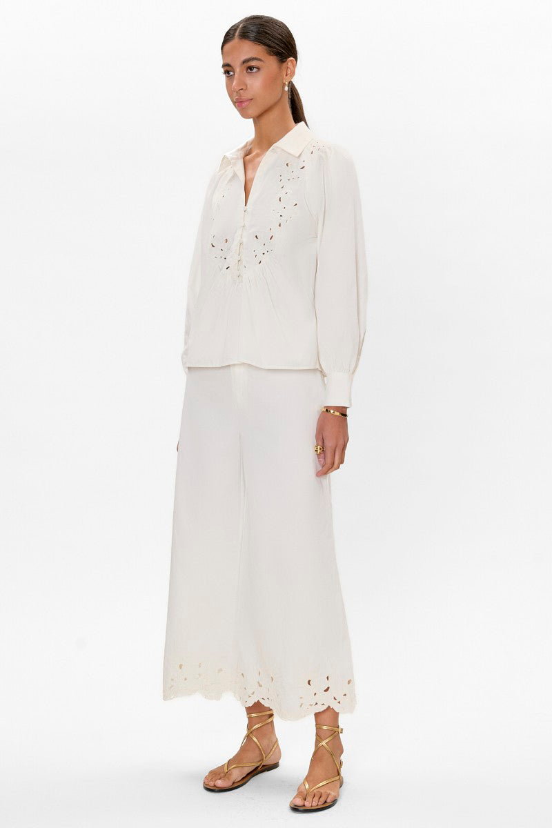 Rebecca Taylor Rachelle popover blouse in ivory, featuring lightweight fabric and relaxed fit, shown on a hanger.