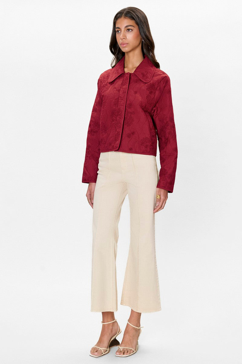 Rebecca Taylor Zuri quilted jacket in dark berry with a fitted design and quilted texture, displayed on a neutral background.