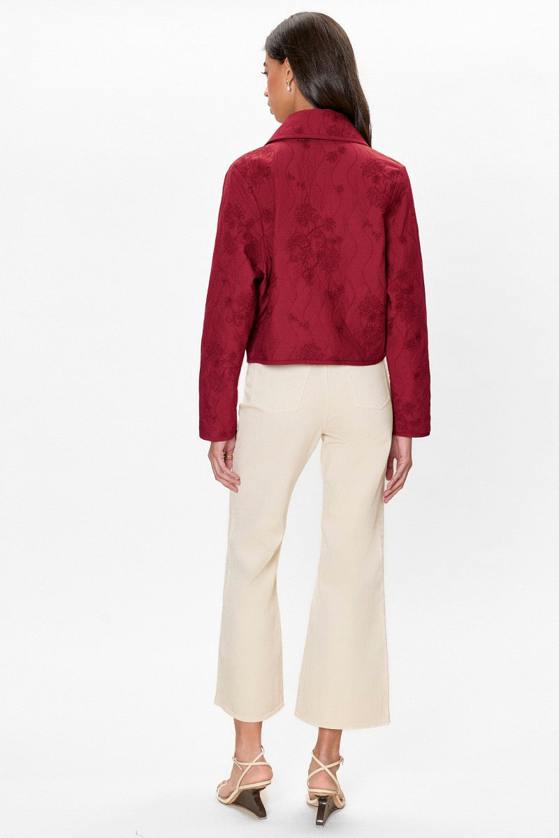Rebecca Taylor Zuri quilted jacket in dark berry with a quilted pattern and stand collar, shown on a hanger.