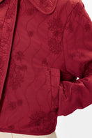 Rebecca Taylor Zuri quilted jacket in dark berry, shown with a padded design, stand-up collar, and quilted texture.