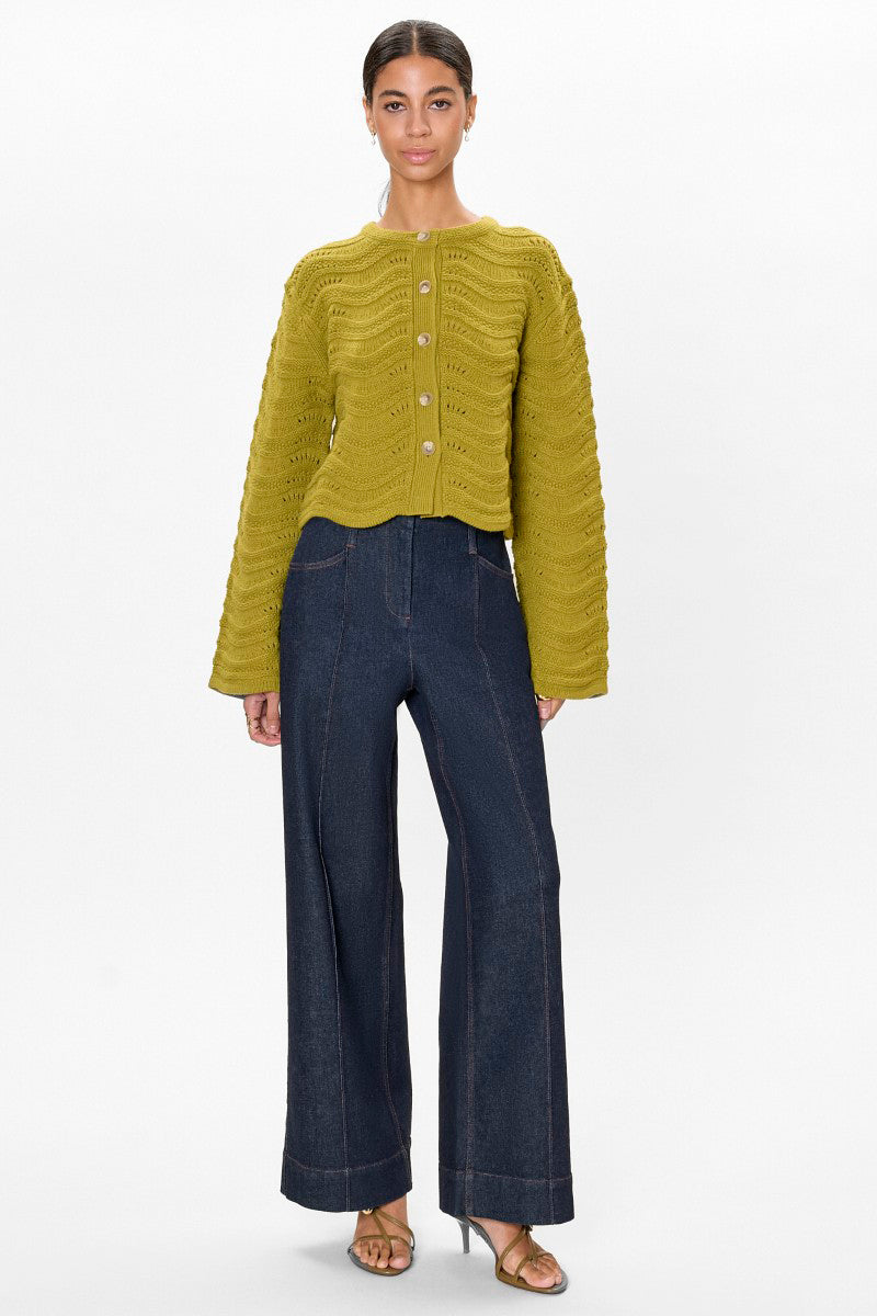 Rebecca Taylor REM knit cardigan in pear green, soft knit top with a relaxed fit and button closure, styled on a model.