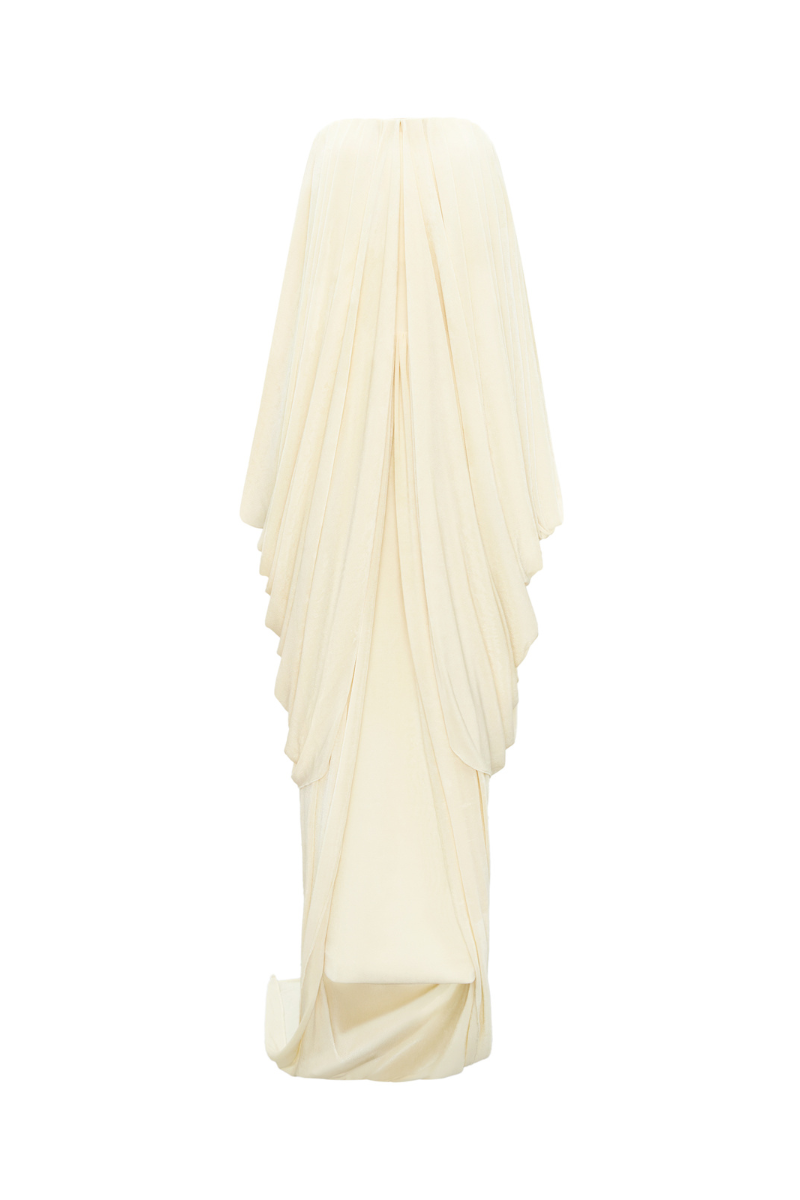 Elegant Butter Muse gown by TONYY featuring flowing fabric and intricate detailing, perfect for formal occasions.