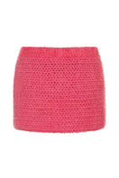 Lalo Thalia pink mini skirt with a fitted waistband and stylish hem, shown on a mannequin. Perfect for casual or dressy outfits.