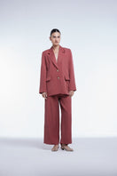 Relaxed single-breasted blazer by Dāl the Label, shown in a neutral fabric with a tailored fit and classic lapel design.