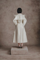 Ivory embroidered trench coat by White Plan featuring detailed embroidery, classic collar, and button closure.