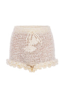 White handmade crochet chrysanthemum shorts by Andreeva featuring intricate floral patterns and a comfortable fit.