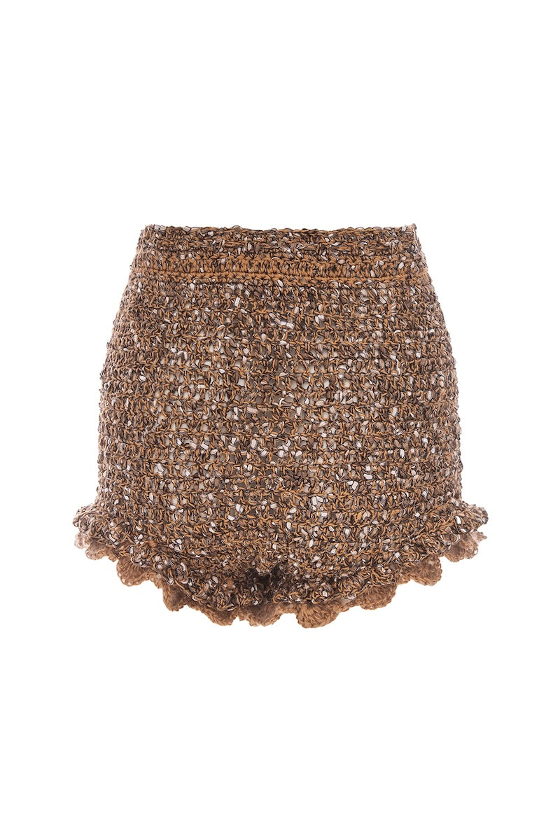 Handmade brown crochet shorts featuring a chrysanthemum pattern by Andreeva, shown on a model.