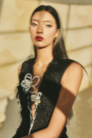 L'SCARLETT sleeveless fringe jacquard V-neck flared gown with intricate pattern and elegant design, suitable for formal occasions.