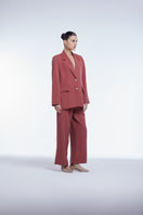 Relaxed single-breasted blazer by Dāl the Label, shown in a neutral color, tailored fit, and classic lapel design.