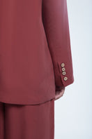 Dāl the Label relaxed single-breasted blazer in neutral fabric, tailored fit with lapel collar and front button closure.