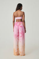 Summer Away LEON Pants in Afterglow color, featuring a relaxed fit and lightweight fabric, stylishly displayed on a model.