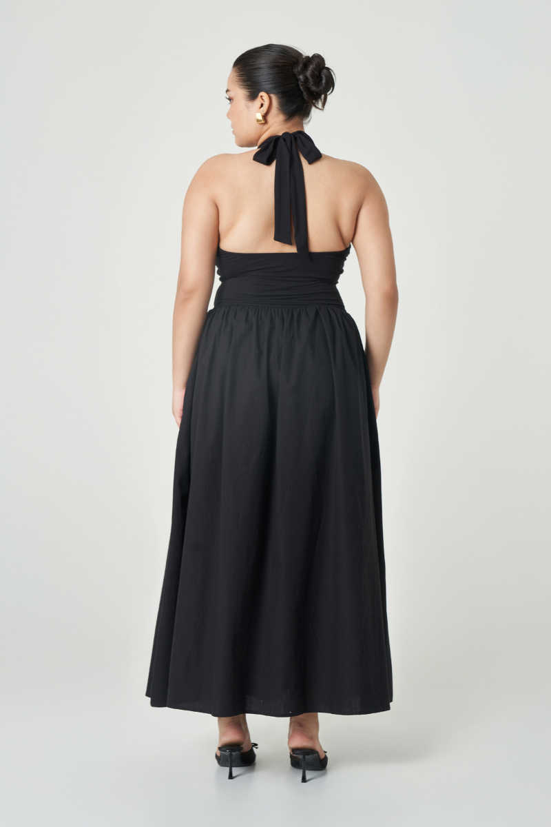 Black Cannes maxi dress by Summer Away with flowing fabric and sleeveless design, perfect for elegant summer occasions.