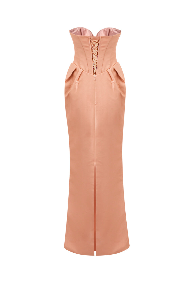 Nude caramel Sendra strapless bow gown by HACCHIC COUTURE featuring a fitted bodice and elegant flowing skirt.