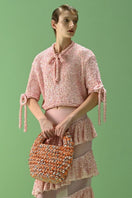 Lalo Salue pink sweater with a cozy knit design, featuring a relaxed fit and ribbed cuffs, perfect for casual wear.
