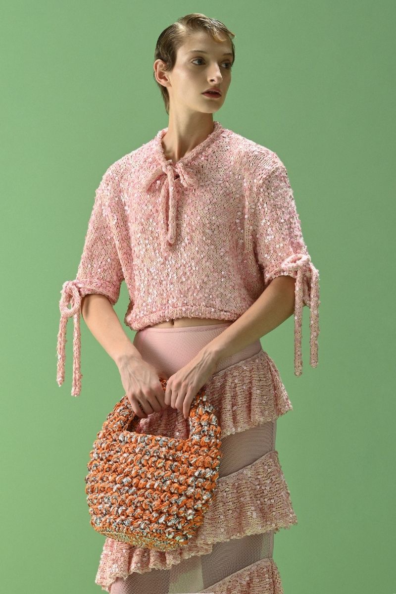 Lalo Salue pink sweater with a cozy knit design, featuring a relaxed fit and ribbed cuffs, perfect for casual wear.