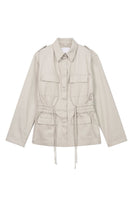 Dāl the Label canvas cotton jacket with a relaxed fit, featuring a front zipper, side pockets, and a casual, stylish design.