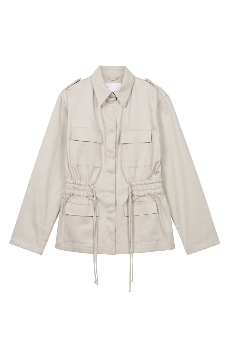 Dāl the Label canvas cotton jacket with a relaxed fit, featuring a front zipper, side pockets, and a casual, stylish design.