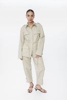 Dāl the Label canvas cotton jacket displayed on a hanger, featuring a casual fit and neutral color for versatile styling.