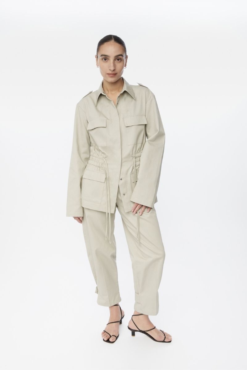 Dāl the Label canvas cotton jacket displayed on a hanger, featuring a casual fit and neutral color for versatile styling.