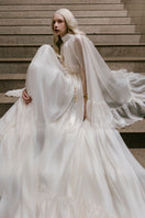 White Plan Antonia gown, elegant floor-length dress with a flowing silhouette, ideal for formal occasions.