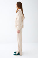 Soft cream sweat pants from ColoReve with a relaxed fit and cozy fabric, shown laid flat on a neutral background.