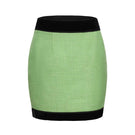 Nana Jacqueline Michelle Green Tweed Mini Skirt shown with a fitted high waist and classic tweed pattern in green and beige tones.