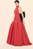 Nihan Peker ÉVAN red gown with elegant flowing fabric and intricate detailing, showcased on a mannequin.