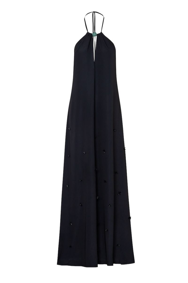 Black Baobab Rondine maxi dress displayed on a model with flowing fabric and elegant design.