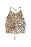 Crochet mother of pearl top by Mirel Prentice featuring intricate crochet details and shimmering pearl accents.