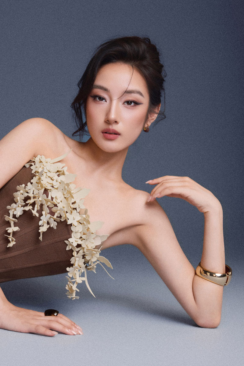 Brown bouquet corset top by Keira Tong, featuring a fitted design and floral pattern, perfect for stylish fashion statements.