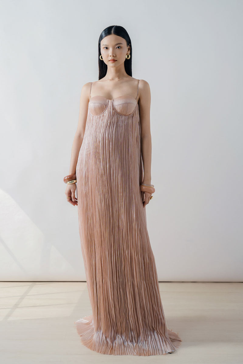 Doc Ban champagne pleated bustier column maxi dress featuring a fitted bodice and flowing skirt, perfect for elegant occasions.