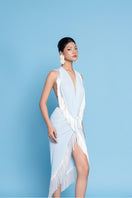 Valenciani fringed scarf with tassel details, soft fabric, and stylish design perfect for adding elegance to any outfit.