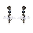 A pair of DEW DROP gray earrings from Aidan & Ice featuring elegant, teardrop-shaped dangle earrings.