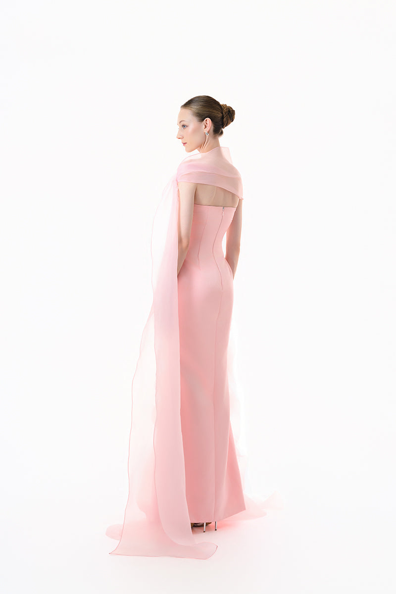 Blush pink draped ruffle gown by Happy Clothing, featuring flowing fabric and elegant ruffle details for formal occasions.